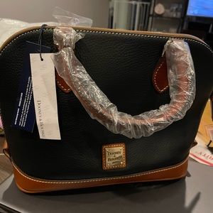 Brand new Dooney & Bourke purse, never used, comes with Dooney & Bourke bag.